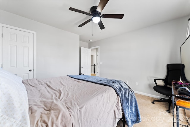 bedroom with carpet flooring, ceiling fan, and baseboards