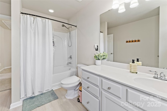 full bathroom featuring toilet, wood finished floors, vanity, and shower / tub combo with curtain