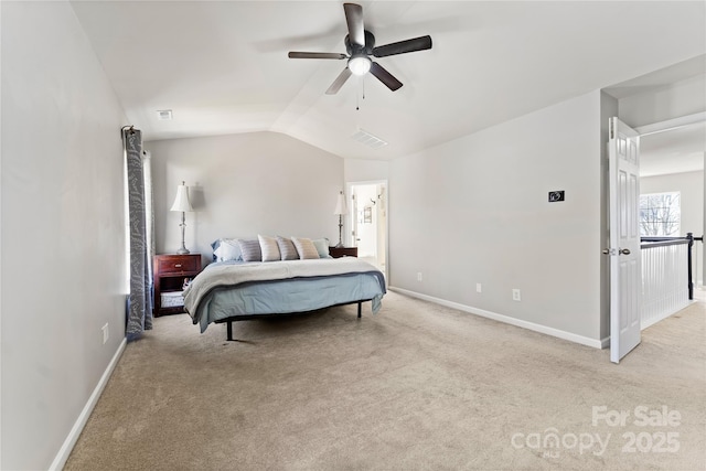 carpeted bedroom with visible vents, baseboards, vaulted ceiling, and a ceiling fan