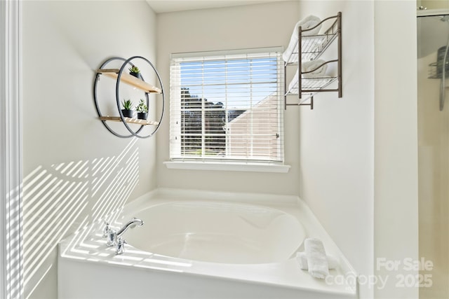 bathroom with a garden tub