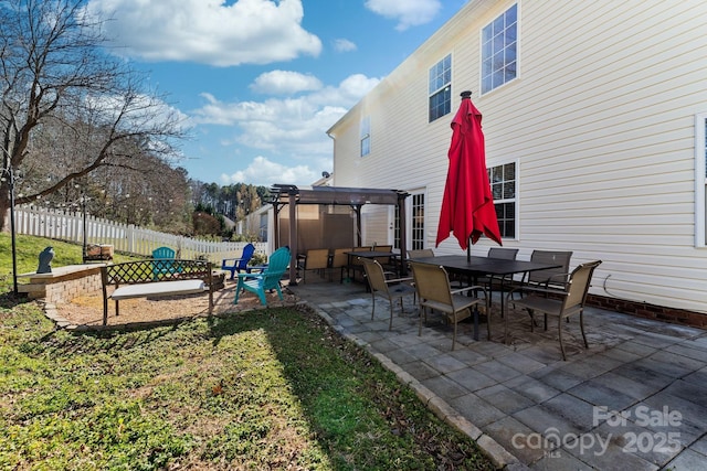 view of yard with outdoor dining area, a patio, and fence