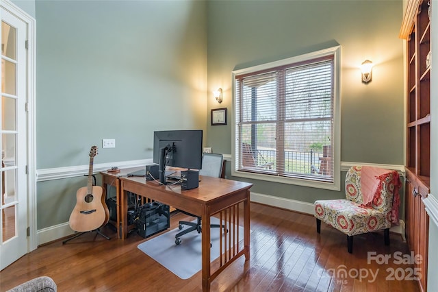 office area featuring wood-type flooring and baseboards