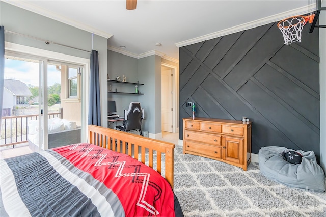 bedroom with baseboards, ceiling fan, access to exterior, crown molding, and a decorative wall