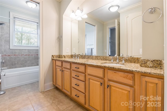 full bathroom featuring double vanity, crown molding, a sink, and tile patterned floors