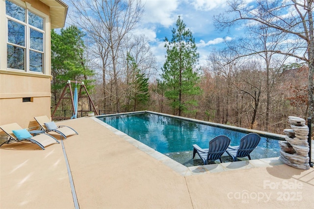 pool with a patio