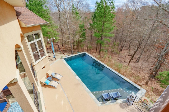 outdoor pool with a patio