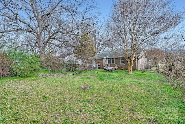 view of yard featuring fence and a gate