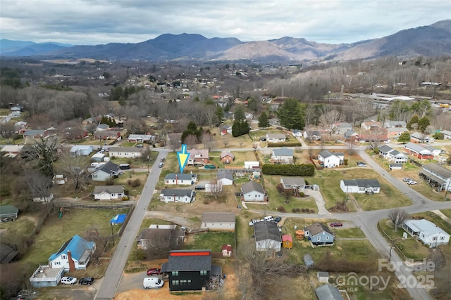 drone / aerial view with a mountain view and a residential view