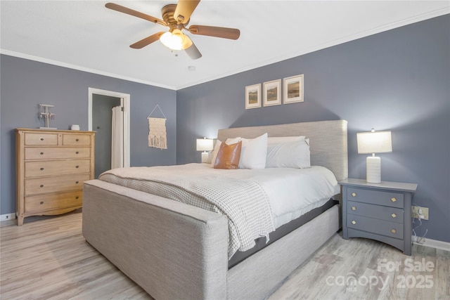 bedroom featuring ornamental molding, ceiling fan, baseboards, and wood finished floors