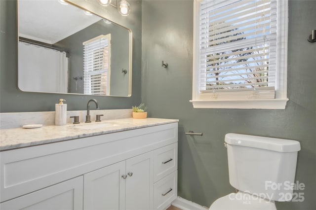 bathroom with vanity and toilet