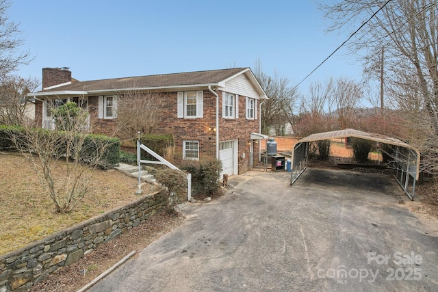 view of property exterior featuring aphalt driveway, brick siding, a chimney, and a carport