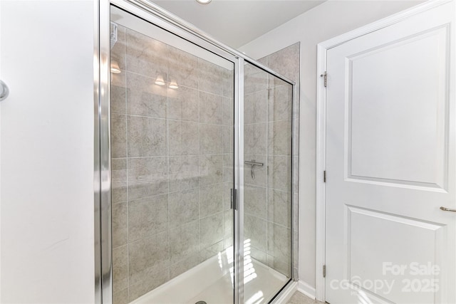 bathroom featuring a shower stall