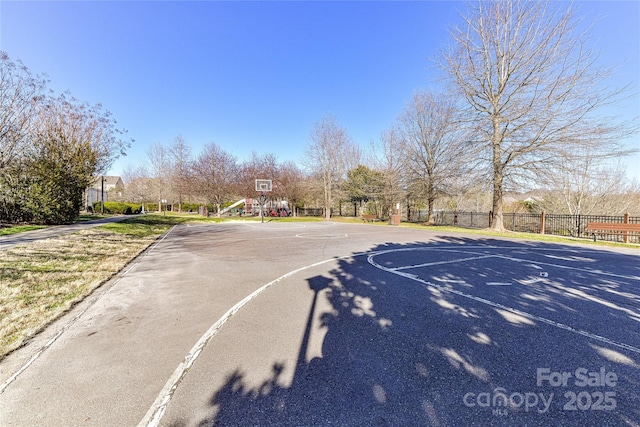 view of basketball court featuring community basketball court and fence