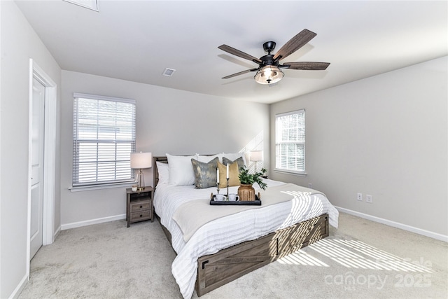 bedroom featuring visible vents, baseboards, carpet, and ceiling fan