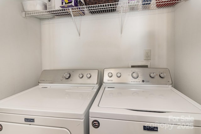 laundry area featuring laundry area and washer and clothes dryer