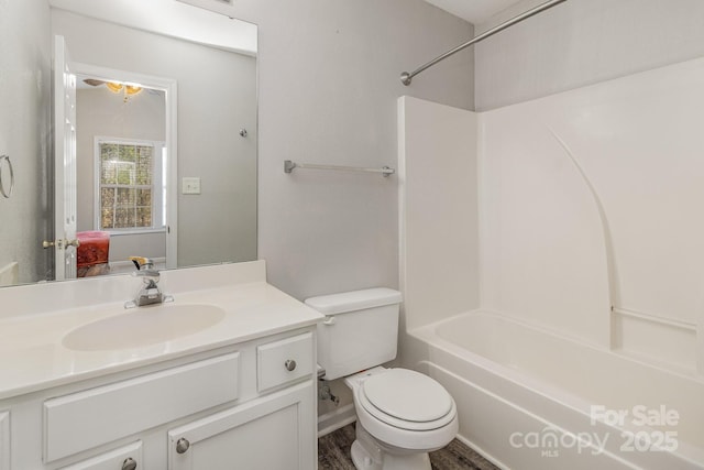 full bathroom with toilet, bathtub / shower combination, and vanity