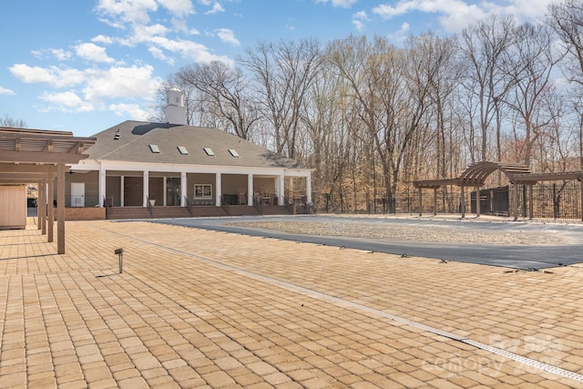 exterior space featuring a patio and a pergola