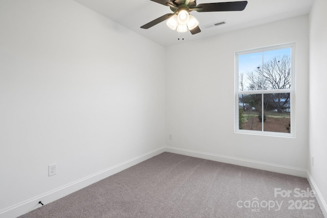 unfurnished room featuring visible vents, baseboards, a ceiling fan, and carpet flooring