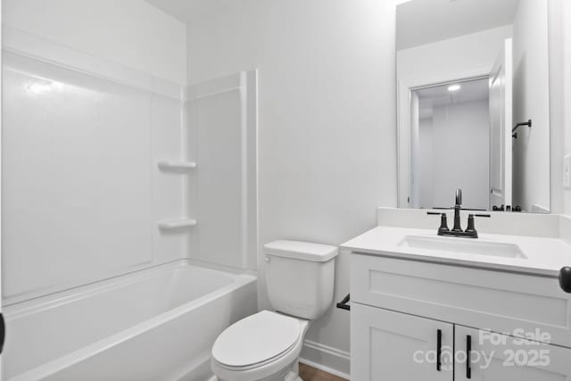 bathroom featuring vanity,  shower combination, and toilet