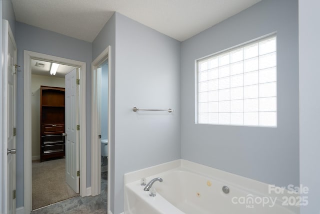 280 Bonaventure Dr, Salisbury, NC 28147 - full bathroom featuring toilet, a jetted tub, a textured ceiling, and visible vents