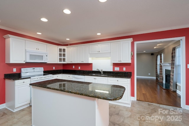 280 Bonaventure Dr, Salisbury, NC 28147 - kitchen featuring white appliances, a fireplace, a sink, white cabinets, and crown molding