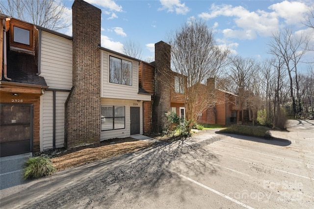 view of front of home featuring a chimney