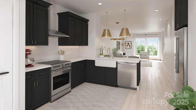 3018 Casting St Unit 20, Charlotte, NC 28206 - kitchen with appliances with stainless steel finishes, wall chimney exhaust hood, open floor plan, dark cabinets, and recessed lighting