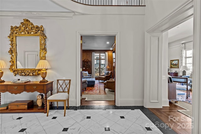 foyer featuring baseboards