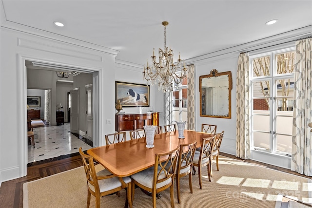 dining room featuring crown molding, a chandelier, wood finished floors, and recessed lighting