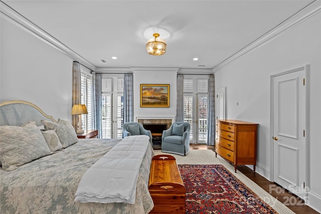 bedroom with baseboards, access to exterior, crown molding, french doors, and recessed lighting