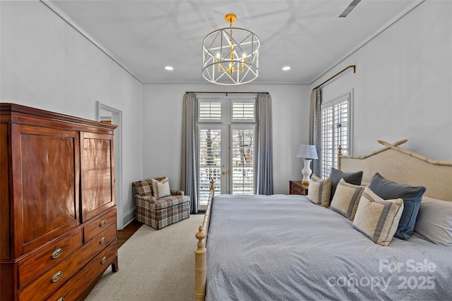 bedroom with french doors, a notable chandelier, visible vents, carpet flooring, and access to outside