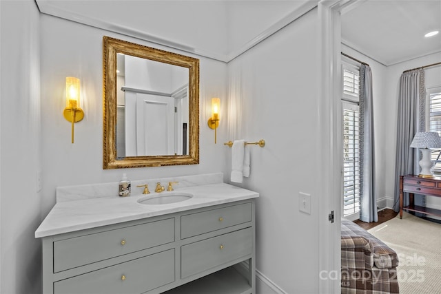 bathroom with baseboards and vanity