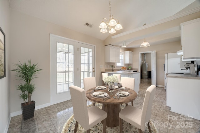 dining area with visible vents, an inviting chandelier, baseboards, and vaulted ceiling