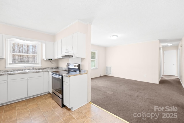 kitchen featuring stainless steel electric range oven, visible vents, a sink, under cabinet range hood, and light colored carpet