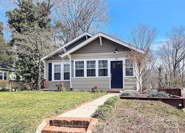 bungalow with a front yard