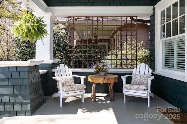 view of patio featuring a porch