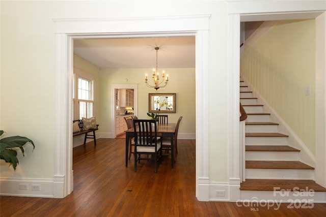 dining space with baseboards, dark wood-style flooring, a chandelier, and stairway