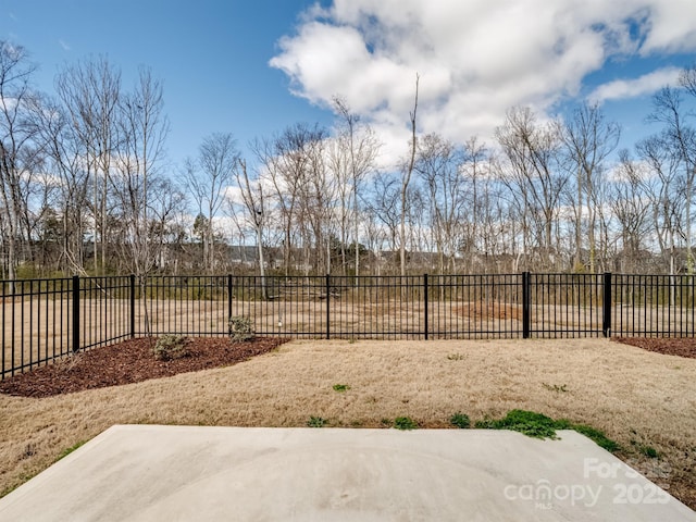 view of yard featuring a patio area and fence