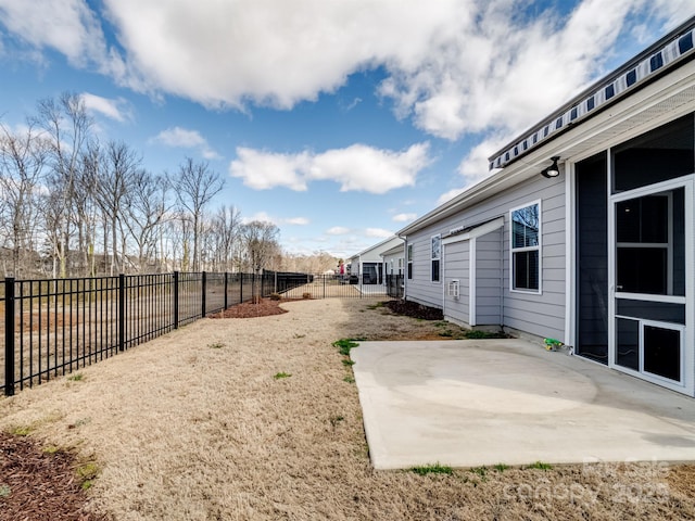 view of yard featuring a patio area and a fenced backyard