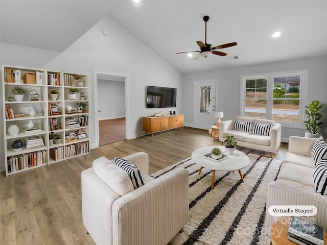 living room featuring ceiling fan, baseboards, wood finished floors, and recessed lighting