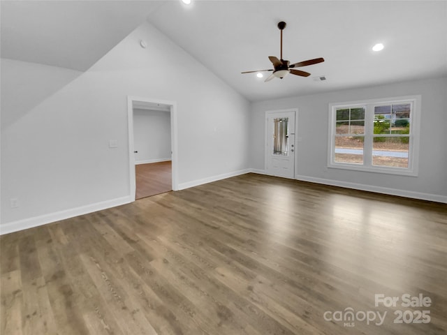 unfurnished living room with recessed lighting, a ceiling fan, vaulted ceiling, wood finished floors, and baseboards