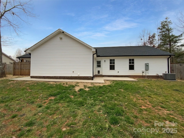 back of property featuring central AC unit, a yard, fence, and a patio