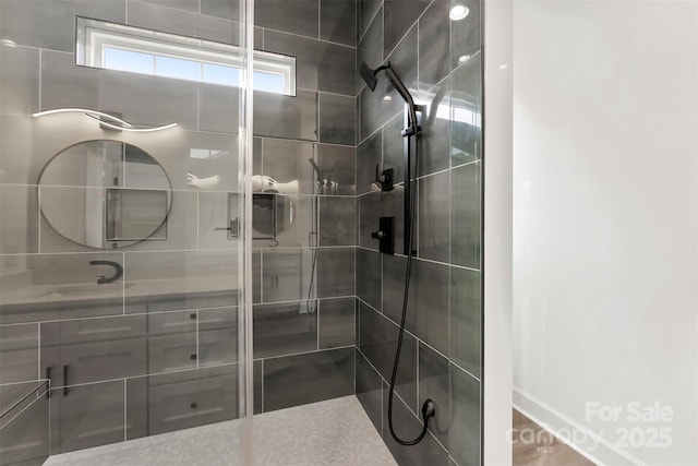 full bath featuring a shower stall and vanity