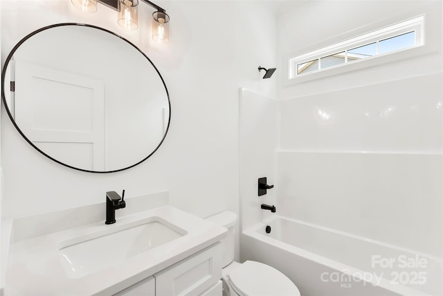 bathroom featuring toilet, shower / tub combination, and vanity