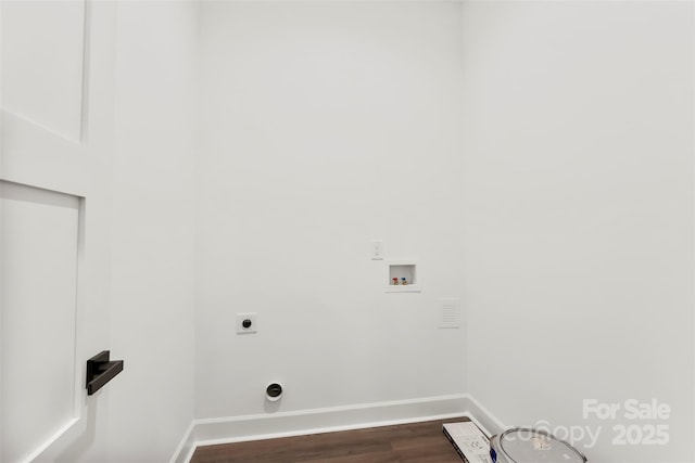 laundry area featuring washer hookup, laundry area, dark wood finished floors, and baseboards