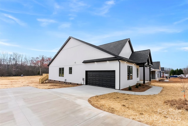 view of side of home with a shingled roof, crawl space, concrete driveway, and an attached garage