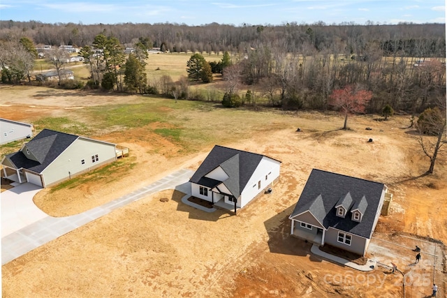 drone / aerial view with a view of trees