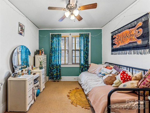 bedroom with a ceiling fan, carpet, and baseboards