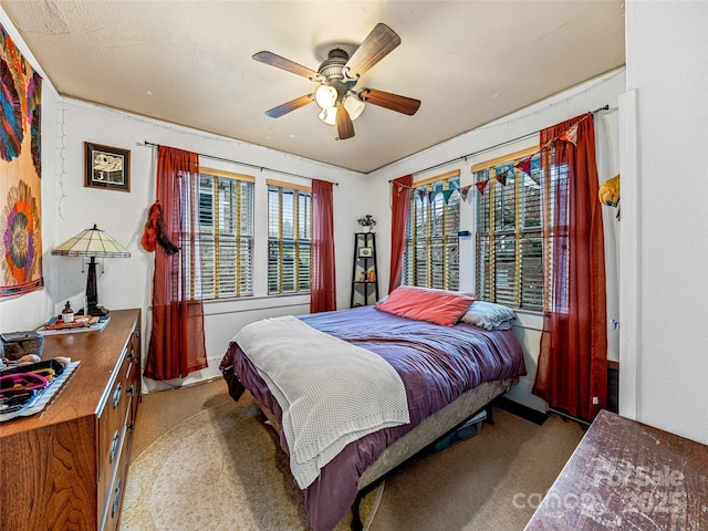 bedroom featuring carpet and ceiling fan