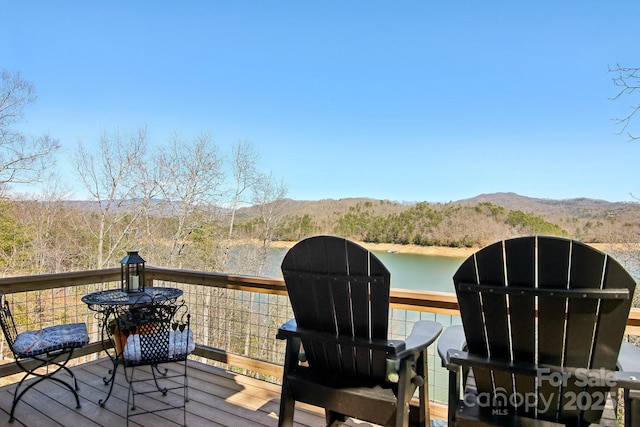 deck featuring a water and mountain view